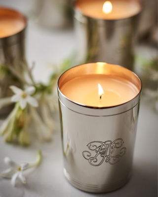 Candle in silver holder with RL monogram.