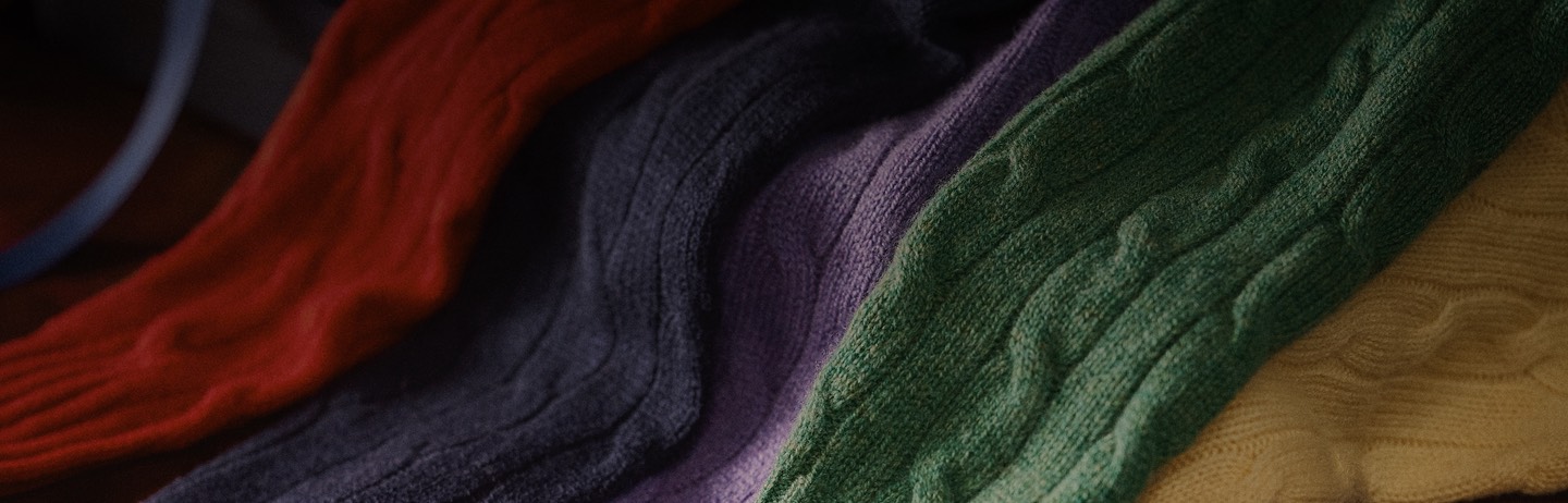 Cable-knit cashmere sweaters in rich colorful hues