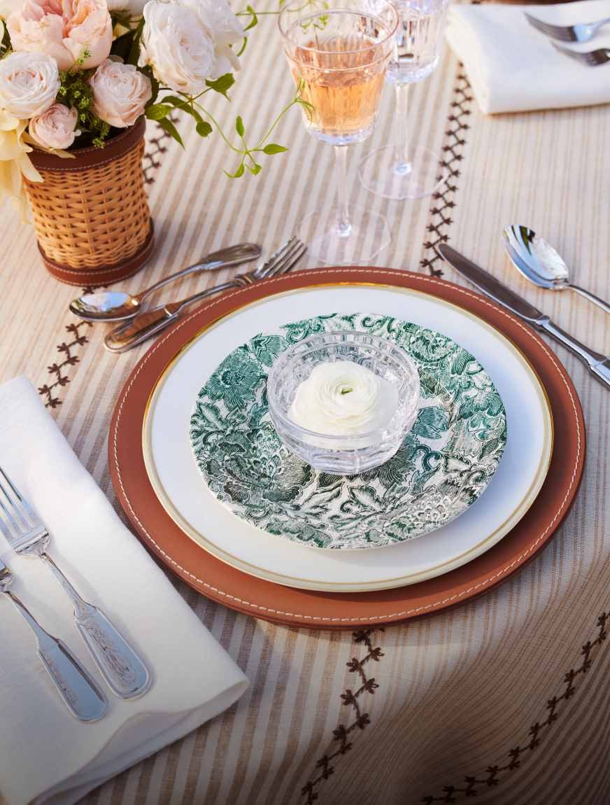 Silverware and diningware on a dinner table.