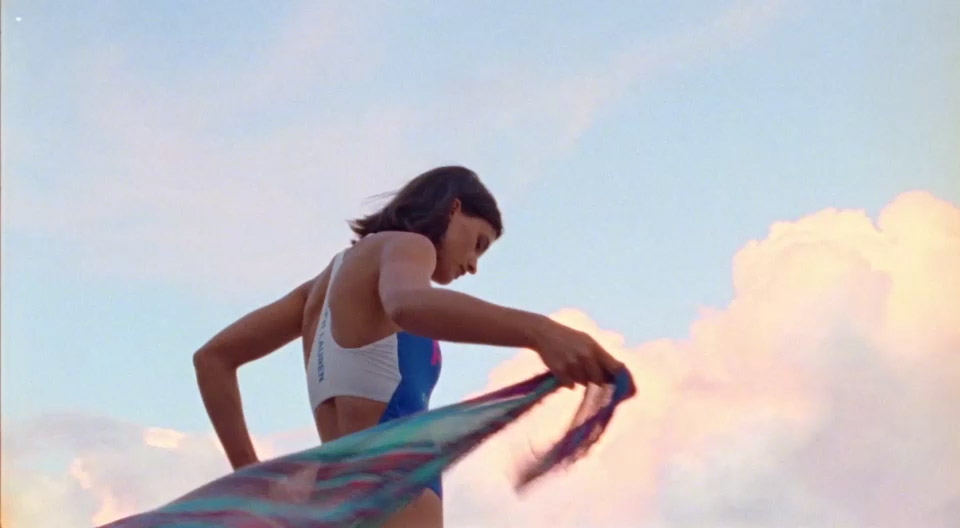 Video of woman in plaid beach wrap