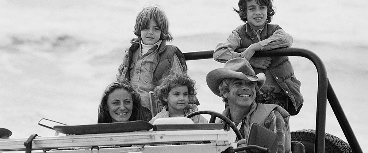 Black-and-white photo of Lauren family in Jeep.