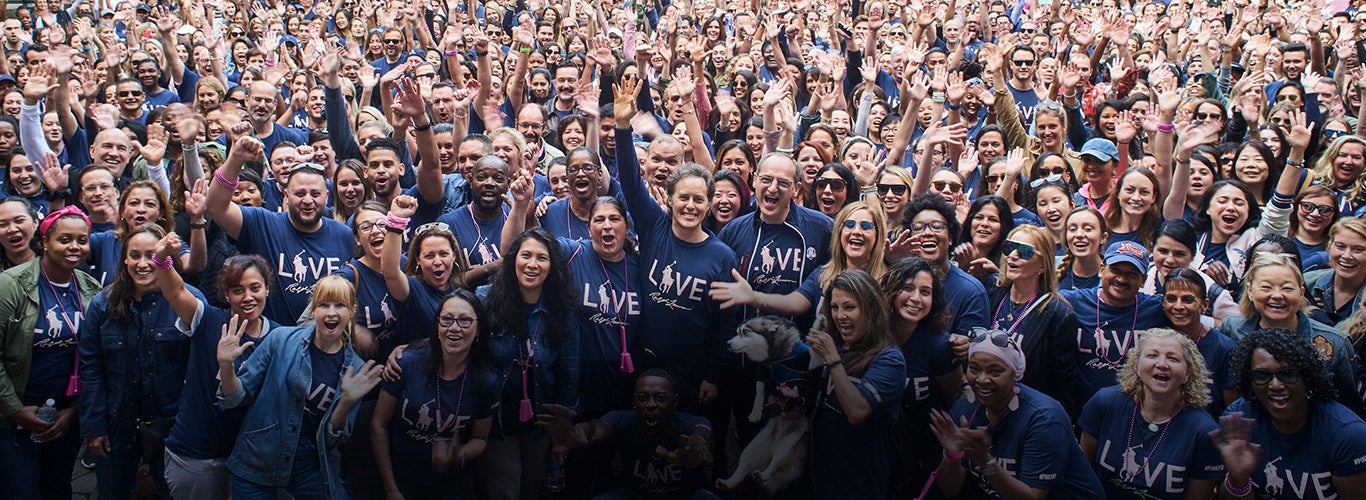 Ralph Lauren employees in navy Pink Pony tees at Pink Pony Walk.