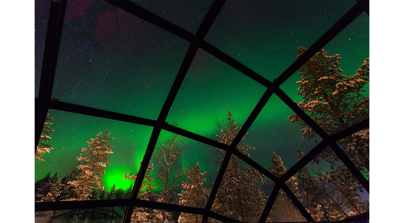 The aurora borealis, enjoyed from the comforts of a glass igloo.