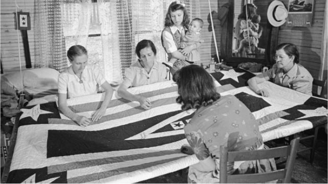 <span>Women of the now-infamous McCoy family of West Virginia work on a patchwork quilt in 1944</span>