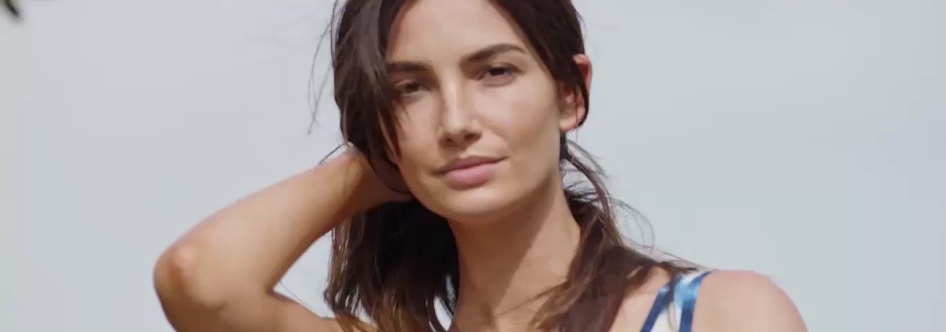 Video of woman in tie-dye dress.
