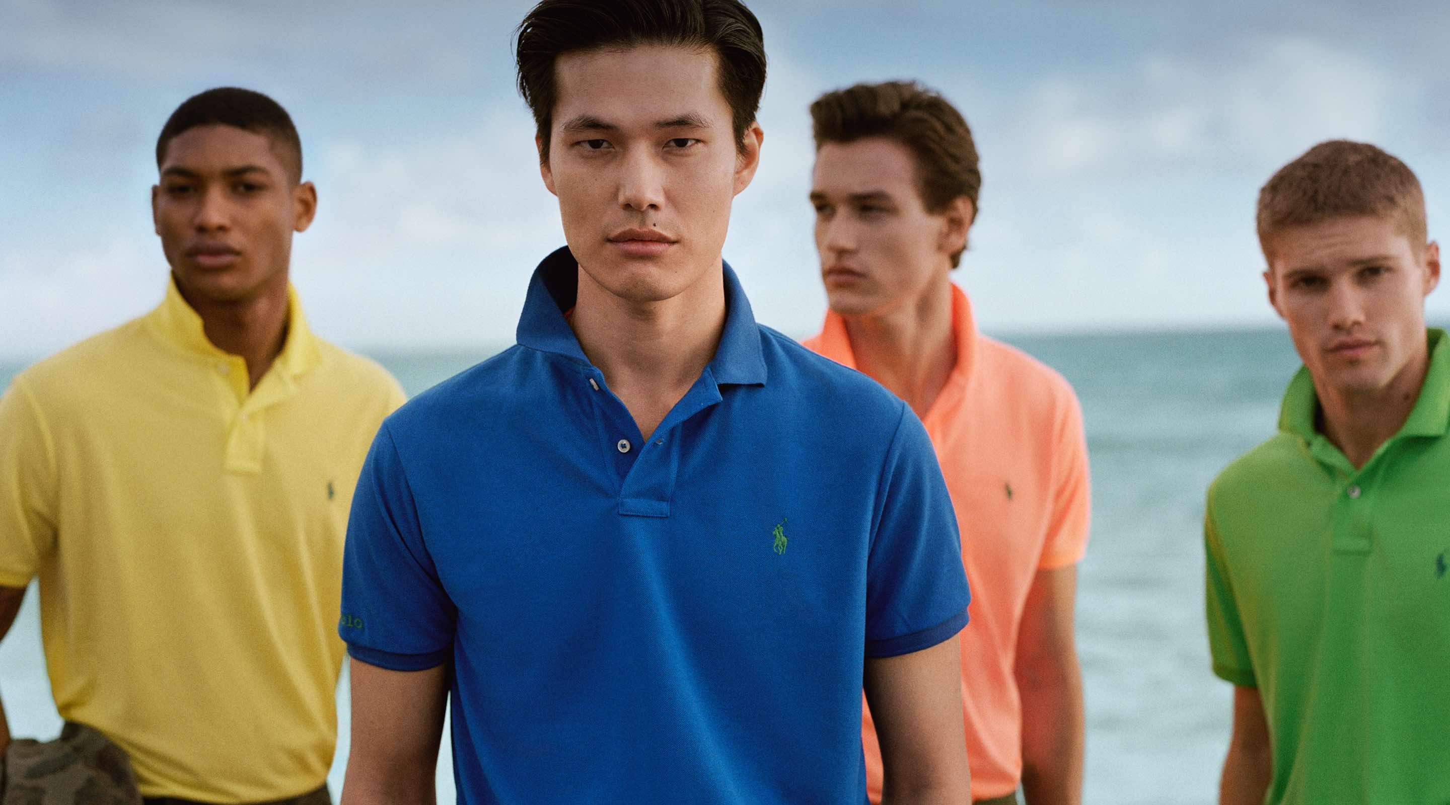 Men in colorful Polo shirts by the ocean