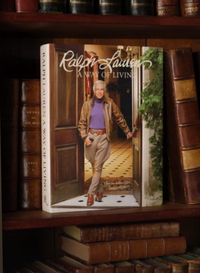 Ralph on cover of A Way of Living book on a bookshelf.