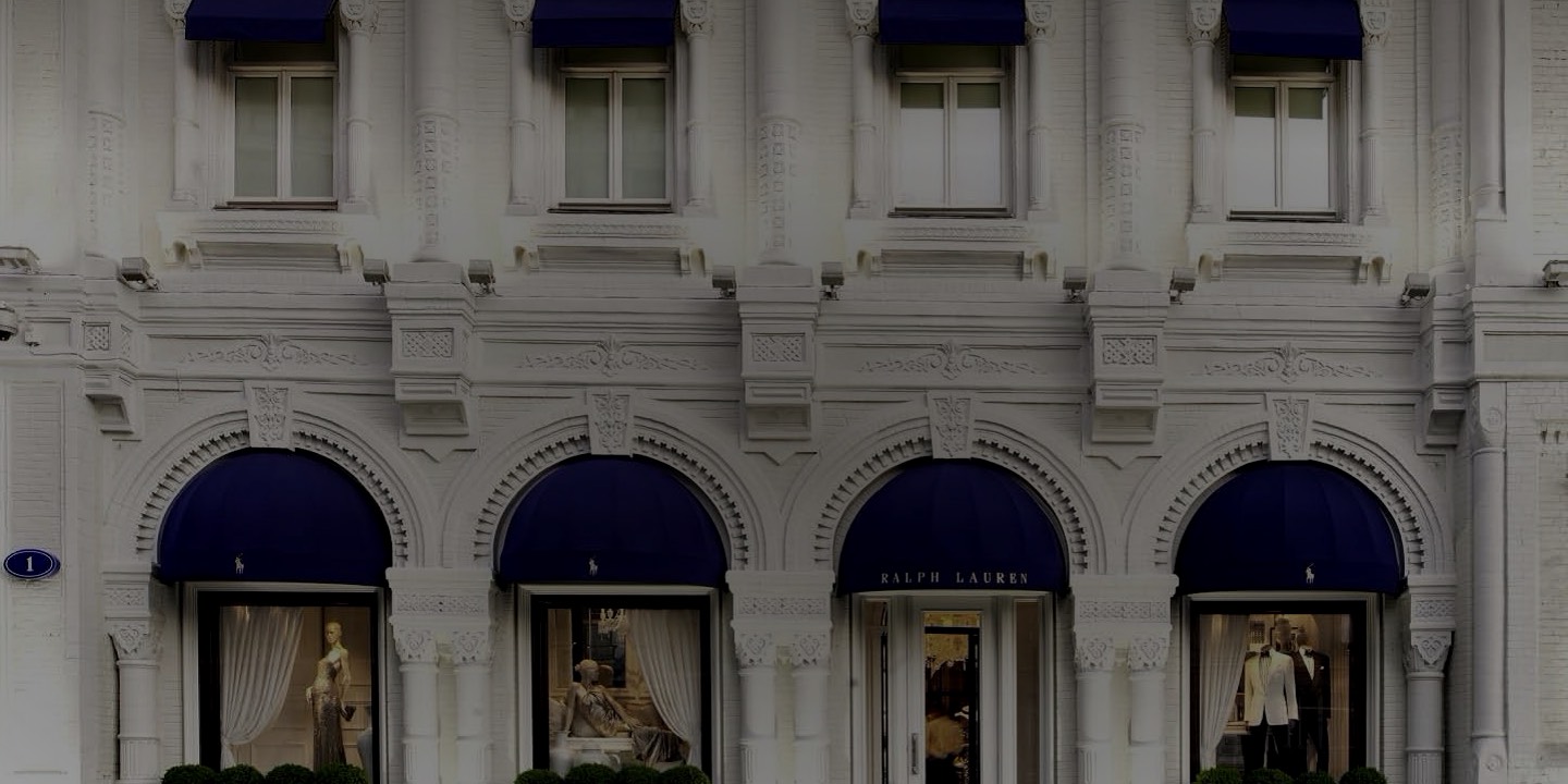 Brick facade of Moscow Ralph Lauren flagship store with blue awnings