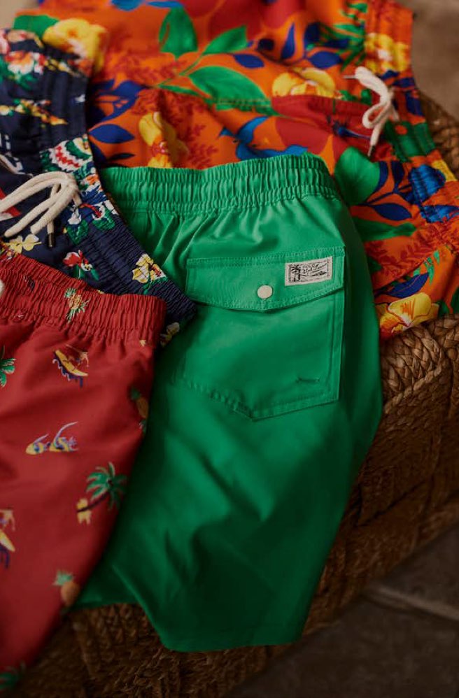 Colorful swim trunks in various patterns, prints & hues