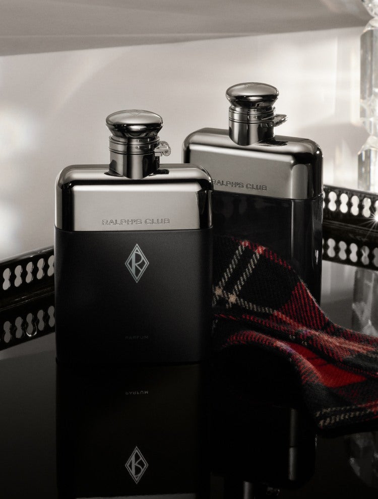 Black-and-steel flask-shaped fragrance bottles.