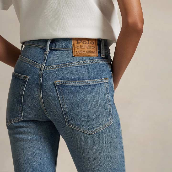 Woman wears slim jeans and white tee.