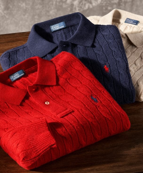 Folded red, navy, and cream cable-knit Polo shirts.