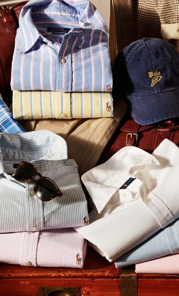 Stacked folded oxford button-down shirts.