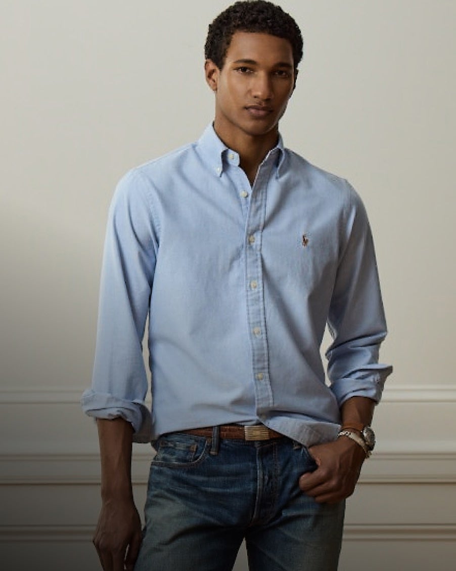 Man wears Classic Fit blue button-down shirt.