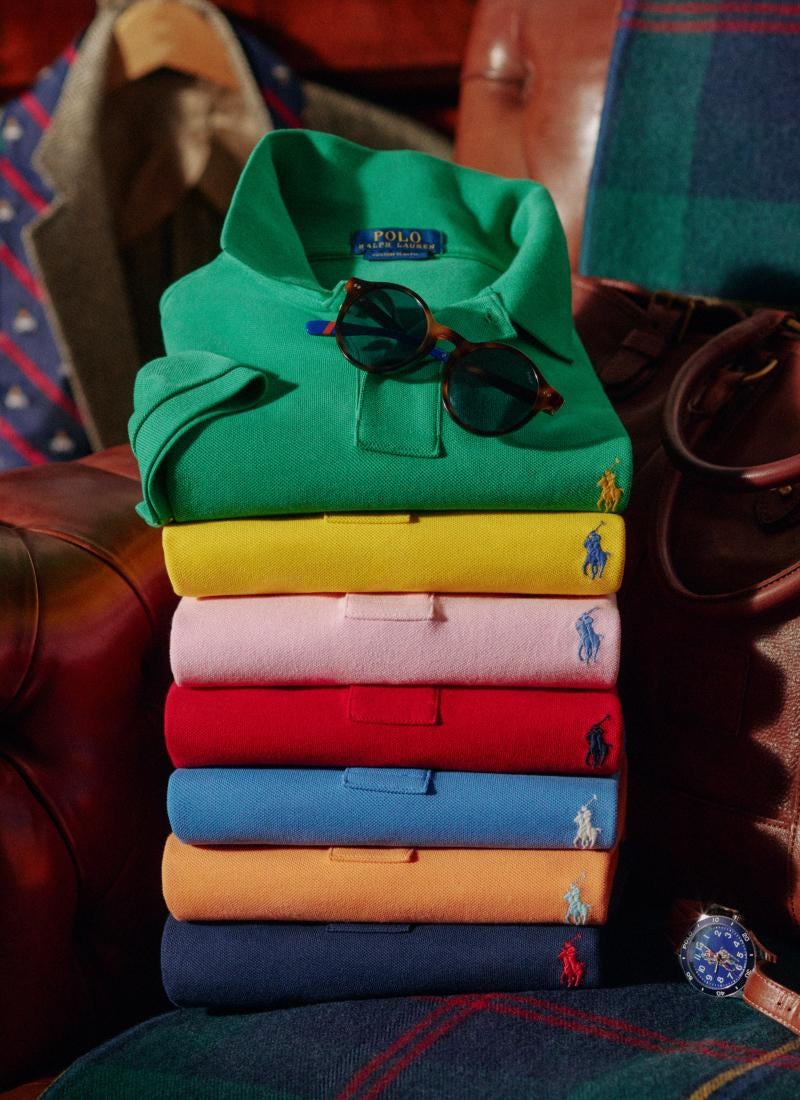 Folded stacked Polo shirts in various hues.