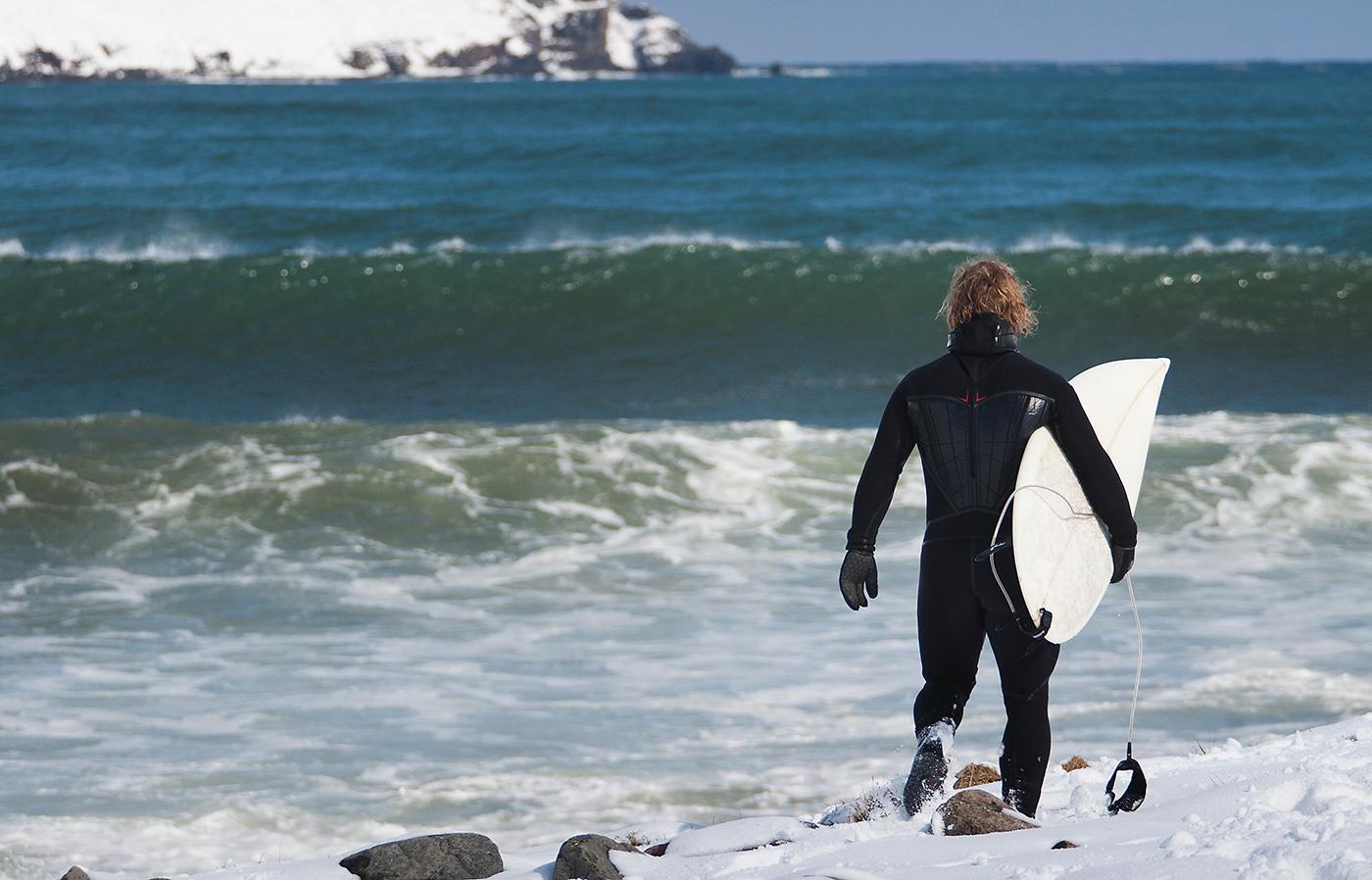 Trekking through the snow in search of the perfect wave