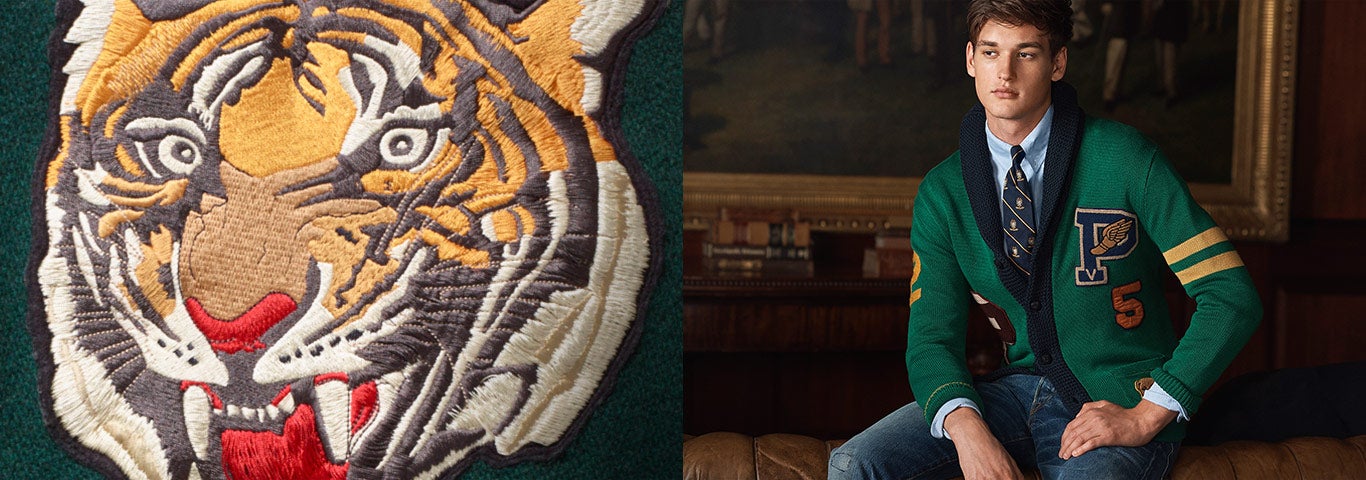 Close-up of embroidered tiger patch; man wears varsity-inspired cardigan  with club. Polo Ralph Lauren