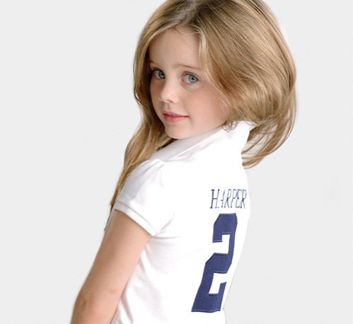 Girl wears customized white Polo shirt.