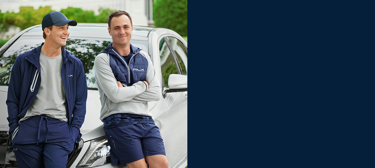 Justin Thomas in half-zip with navy quilting & grey jersey sleeves