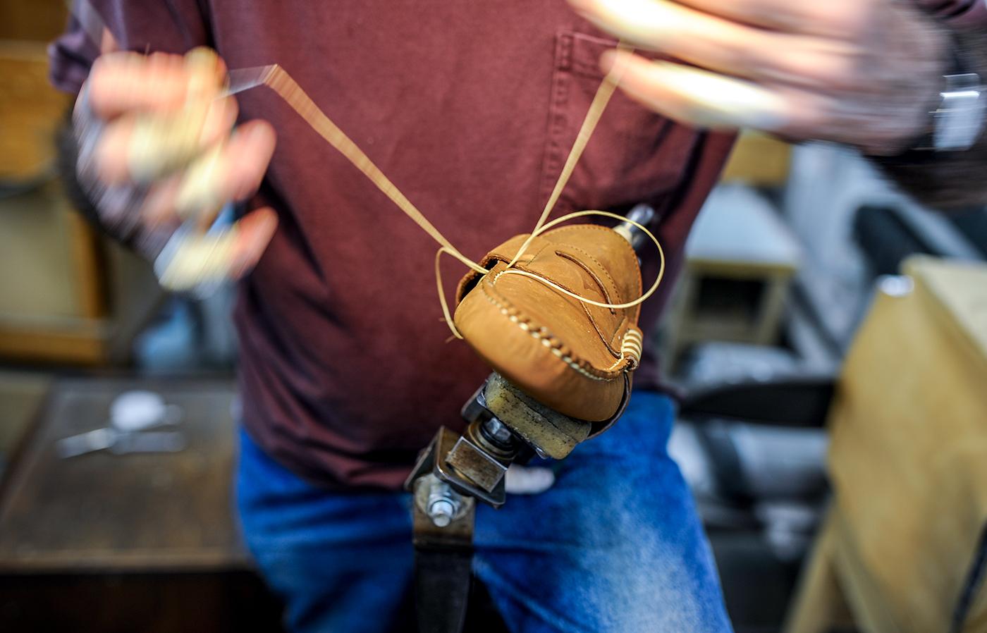 Hand-sewing the saddle to the shoe gives the loafer its distinctive beefroll shape.