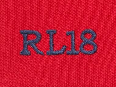 Navy embroidered 'RL18' text on red fabric
