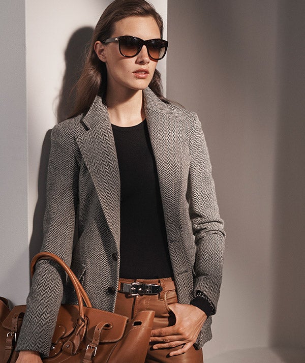 Woman in grey tweed blazer