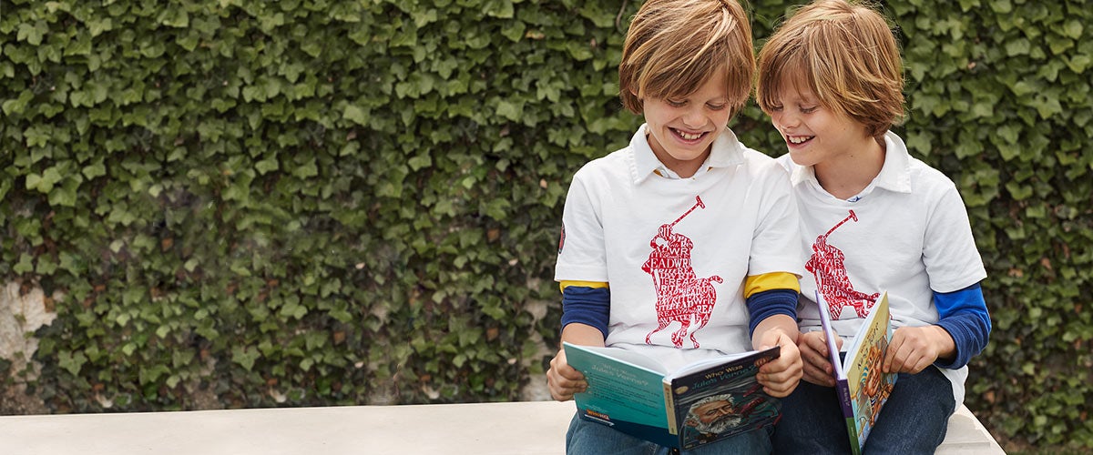 Boys in Literacy tees read books.