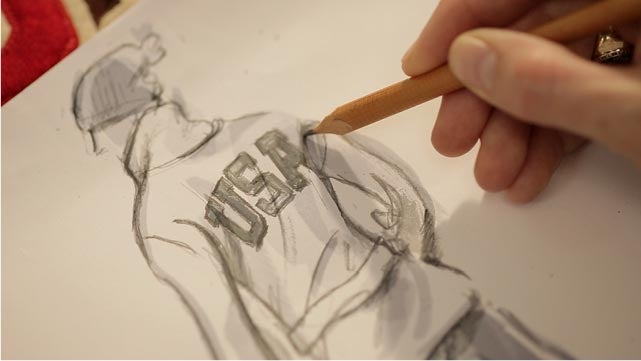 Patches, sketches and other sources of inspiration for Ralph Lauren’s official Team USA Opening Ceremony Cardigan cover a design table at company headquarters
