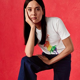 Patti Harrison in white tee with large rainbow Polo Pony graphic