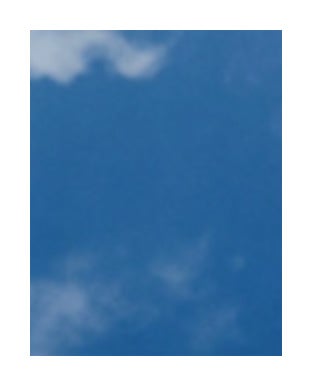 Blue sky with wispy white clouds