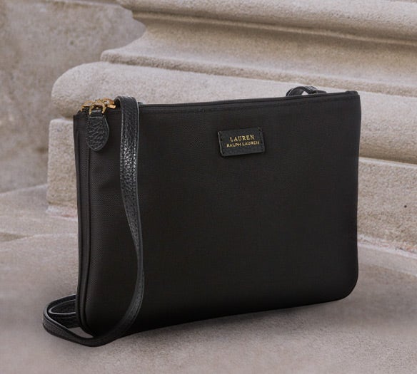Black leather backpack with front flap drawstring closure