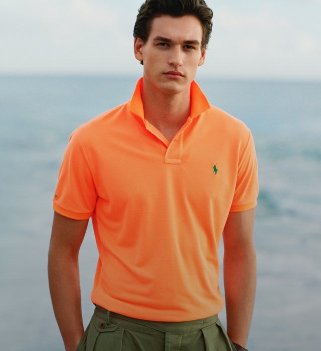 green polo shirt with orange horse