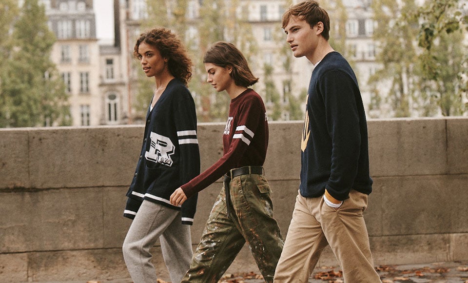 Men & women walking down street in custom sweaters