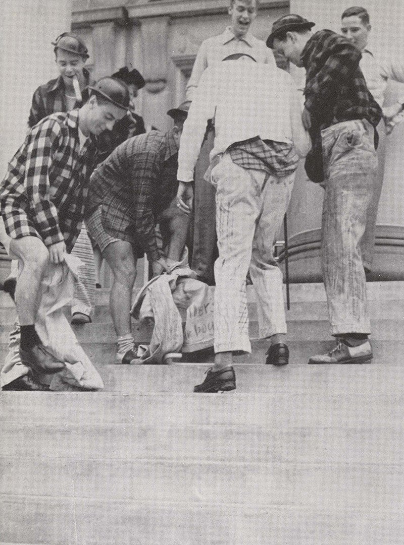 Seniors from a 1943 class take part in a tradition of recovering cords “stolen” by freshmen from their fraternity