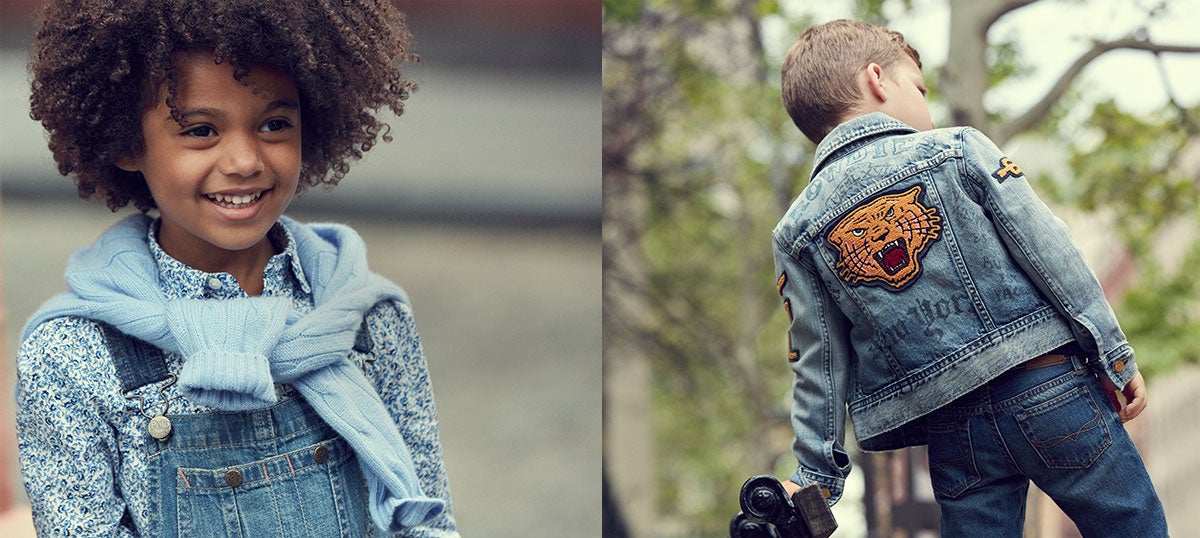 Girl wears denim overalls; boy wears denim jacket with embroidered tiger patch at back.