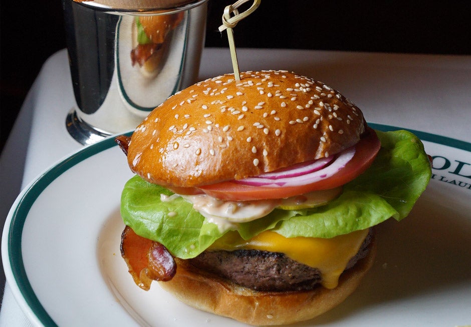 Cheeseburger with bacon, lettuce, tomato, and onion.