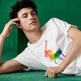 Jacob Bixenman in white tee with large rainbow Polo Pony graphic