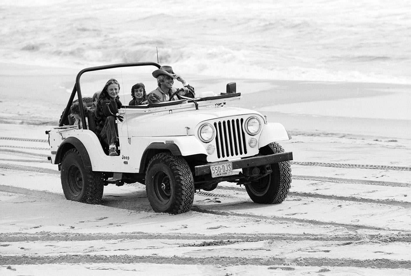 Ralph Lauren and family, making the most of the CJ-5’s four-wheel drive, on a beach in East Hampton, in 1977