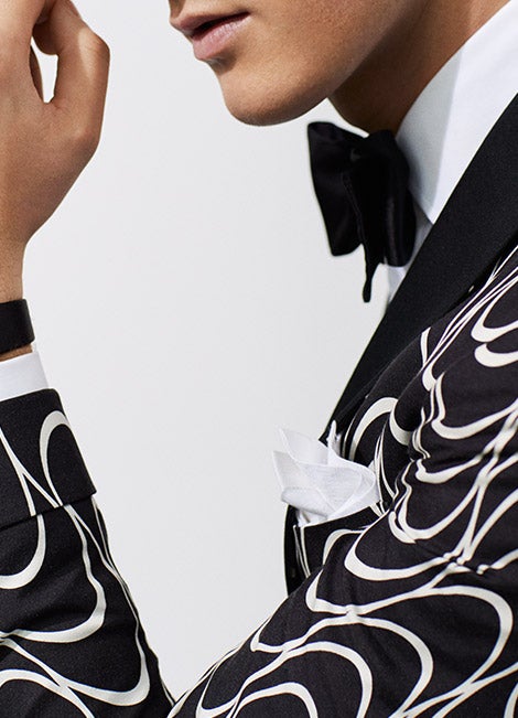 Man in black-and-white dinner jacket with Art Deco print