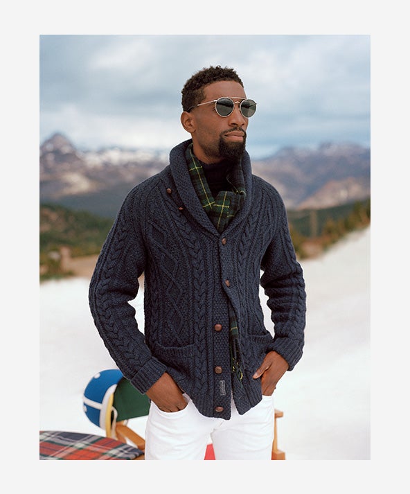 Man in blue-grey Aran-knit shawl cardigan with wooden buttons
