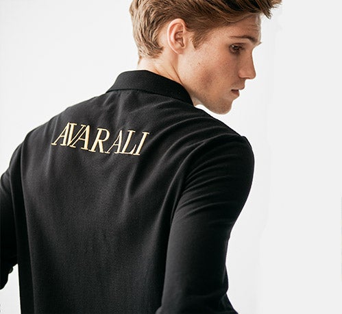 Photograph of man in custom black long-sleeve Polo shirt