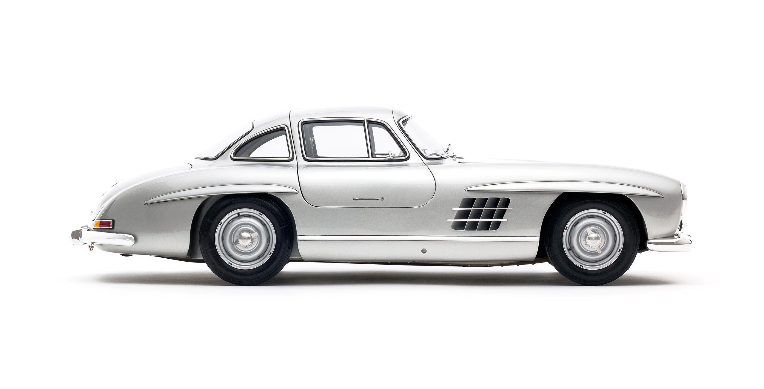 The 1955 Mercedes Benz 300 SL Coupe “Gullwing” was the fastest production car of its time, the first to use fuel injection directly into the cylinders for a top speed of 161 miles per hour