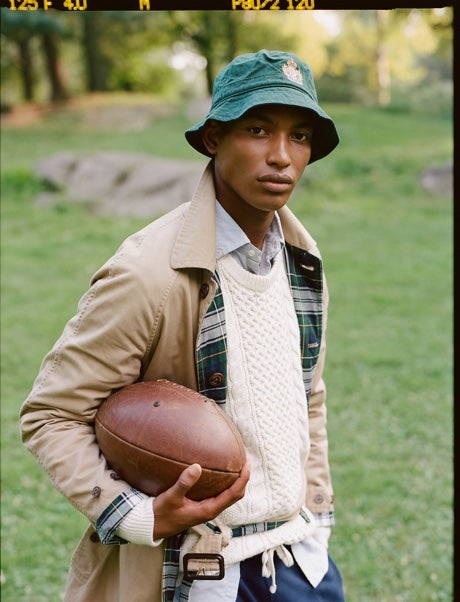 Men in various spring sweaters on lawn
