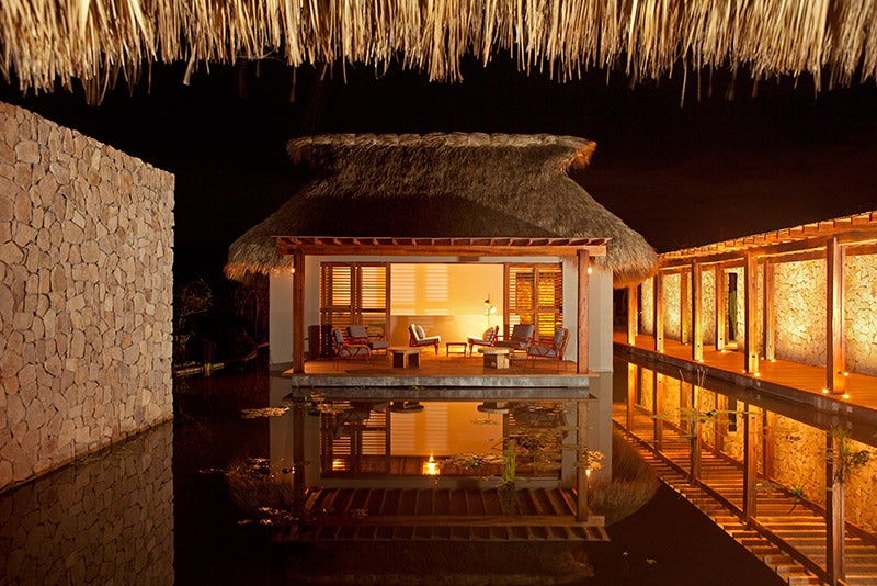 One of Hotel Escondido’s 16 thatched-roof bungalows
