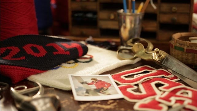 Patches, sketches and other sources of inspiration for Ralph Lauren’s official Team USA Opening Ceremony Cardigan cover a design table at company headquarters