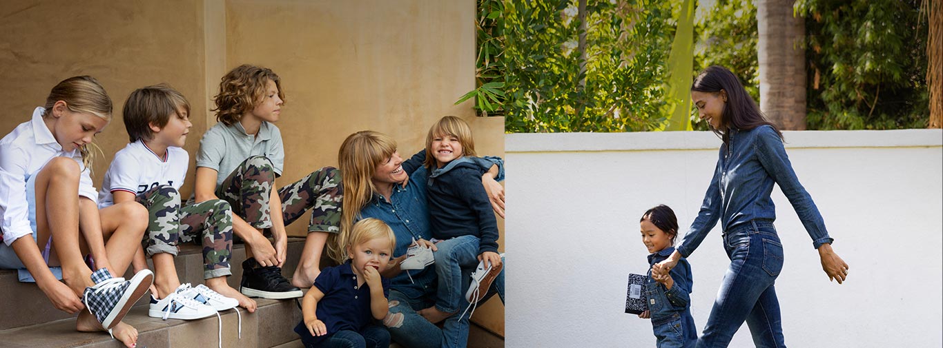 Group of kids in back to school outfits; mom and daughter in denim outfits walk to school.