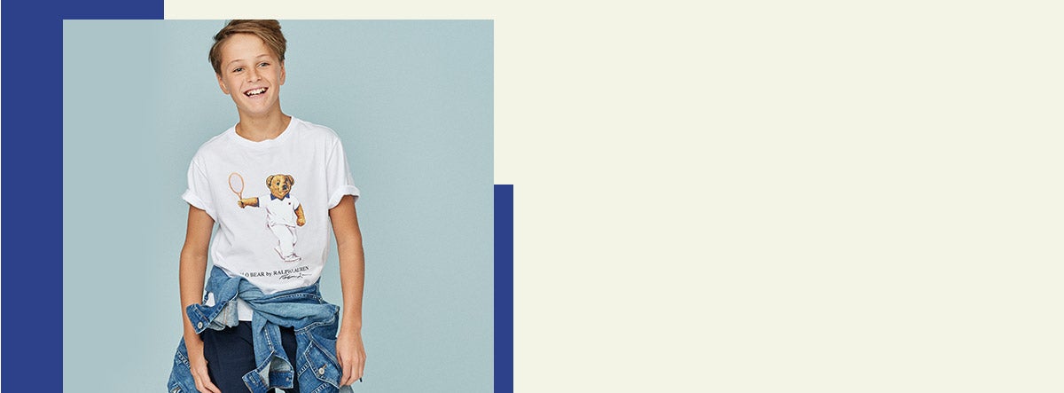 Boy wears tennis Polo Bear tea with jean jacket around waist.