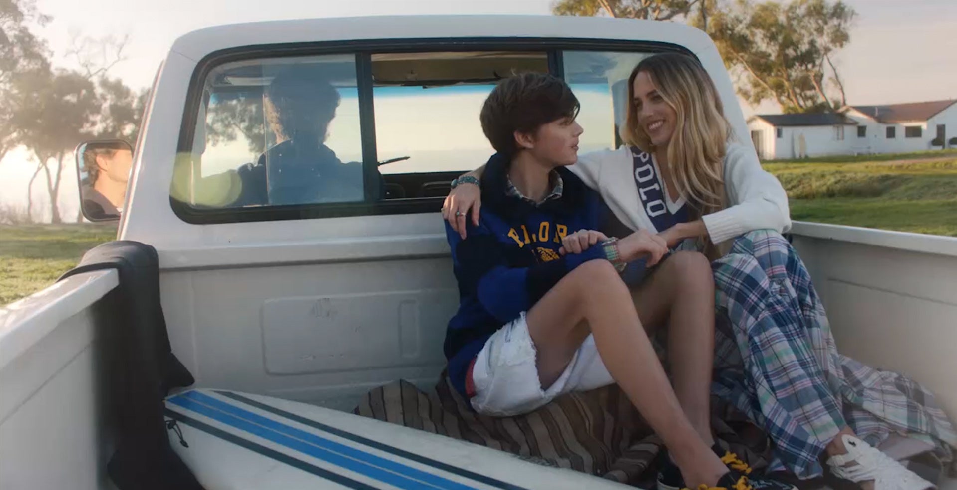 Mother & father drive with son in truck & on beach