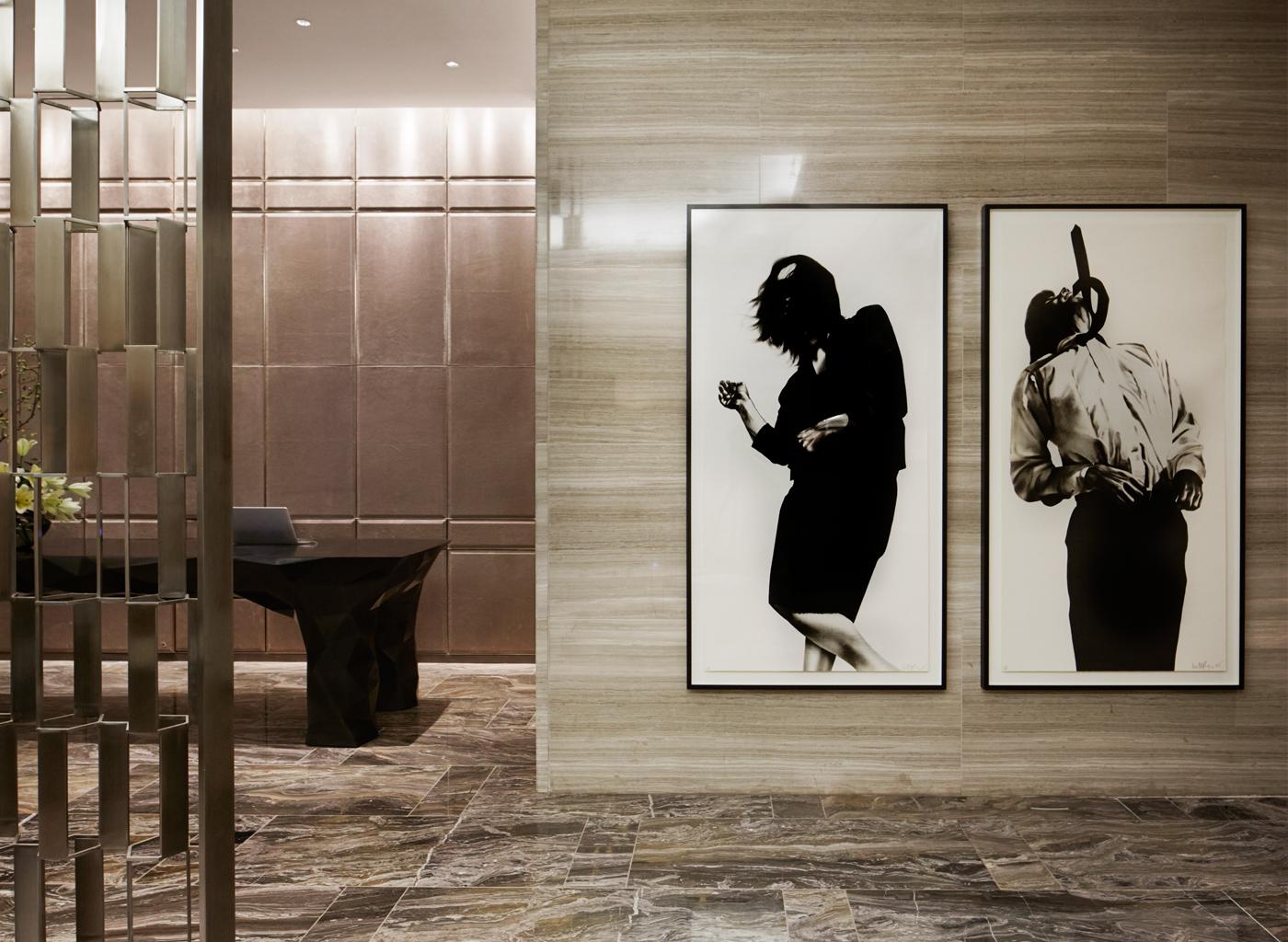 Two works from Robert Longo's 1979 series "Men in the Cities" adorn a wall in the lobby of the Park Hyatt New York.