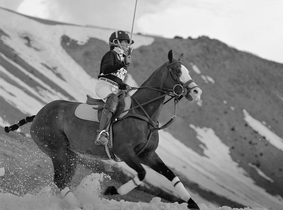 Polo player on horseback in snow